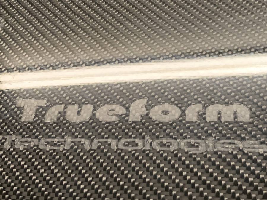Carbon fiber composite panel with Truform Technologies branding