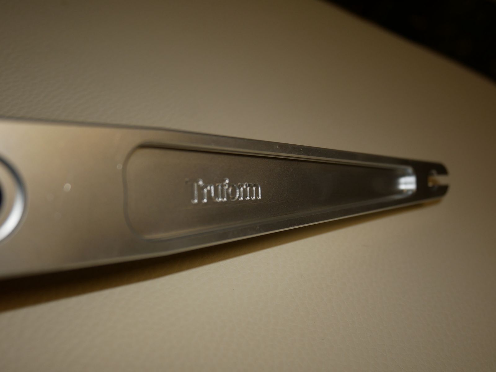 Close-up of the engraved Truform logo on a machined wrench