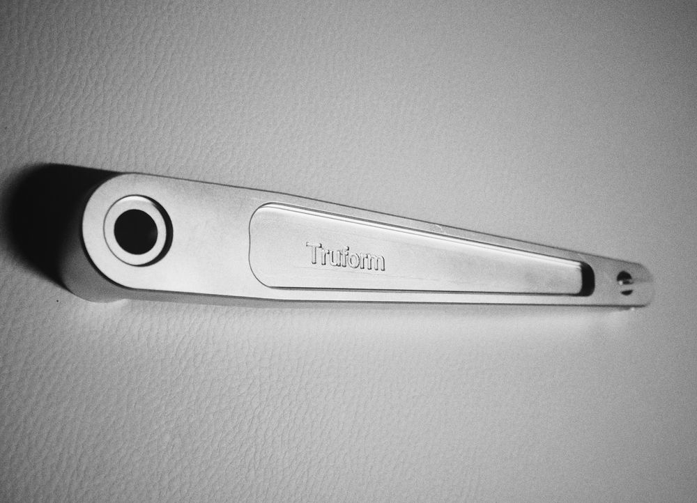 Machined aluminum wrench engraved with the Truform name